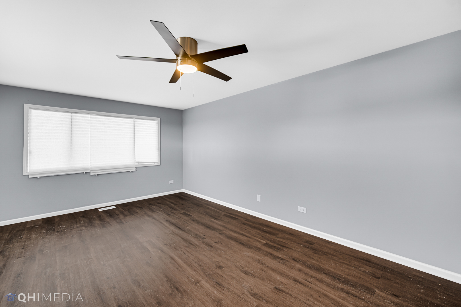 157 Virginia Court Streamwood, IL 60107 - Photo 15 of 17 an empty room with wooden floor fan and windows