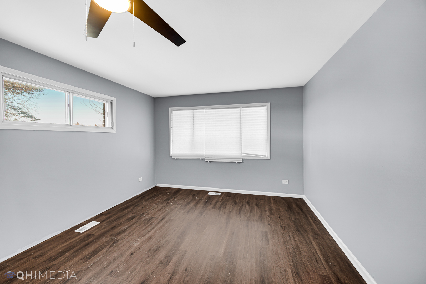 157 Virginia Court Streamwood, IL 60107 - Photo 17 of 17 an empty room with wooden floor and windows