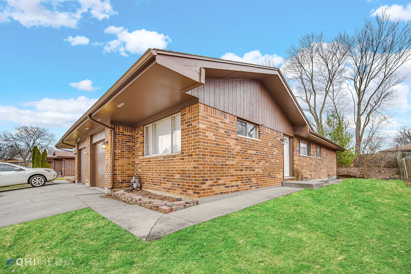 157 Virginia Court Streamwood, IL 60107 - Photo 2 of 17 a view of a house with a yard