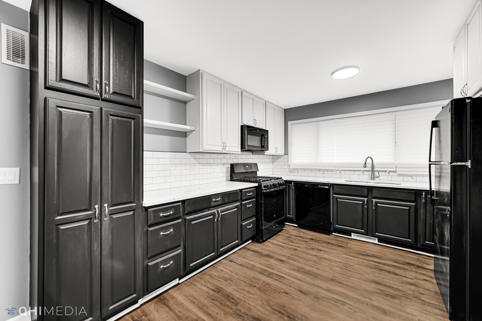 157 Virginia Court Streamwood, IL 60107 - Photo 6 of 17 a kitchen with stainless steel appliances granite countertop a refrigerator and a sink