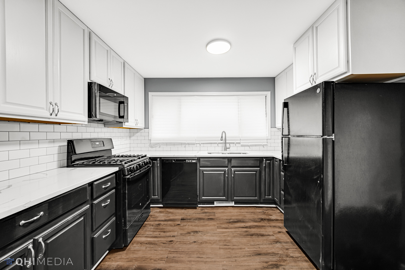 157 Virginia Court Streamwood, IL 60107 - Photo 7 of 17 a kitchen with stainless steel appliances granite countertop a refrigerator a sink and a stove