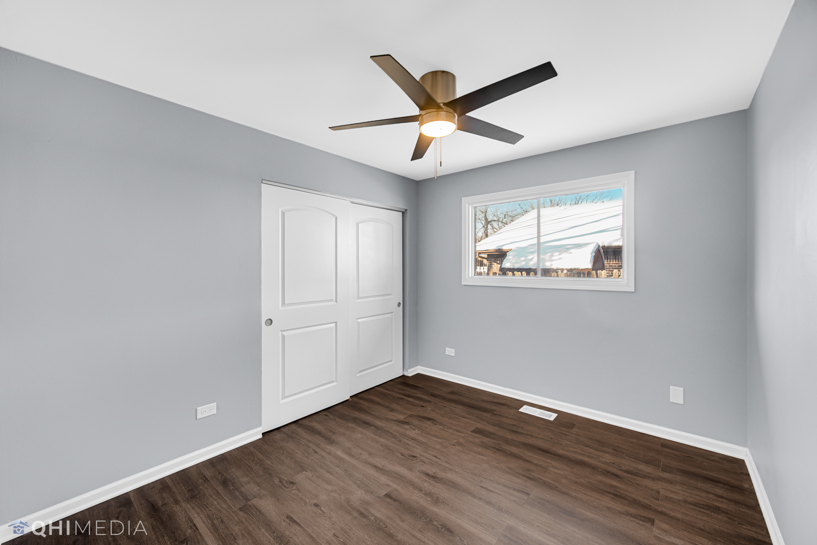157 Virginia Court Streamwood, IL 60107 - Photo 9 of 17 a view of a big room with wooden floor closet and windows