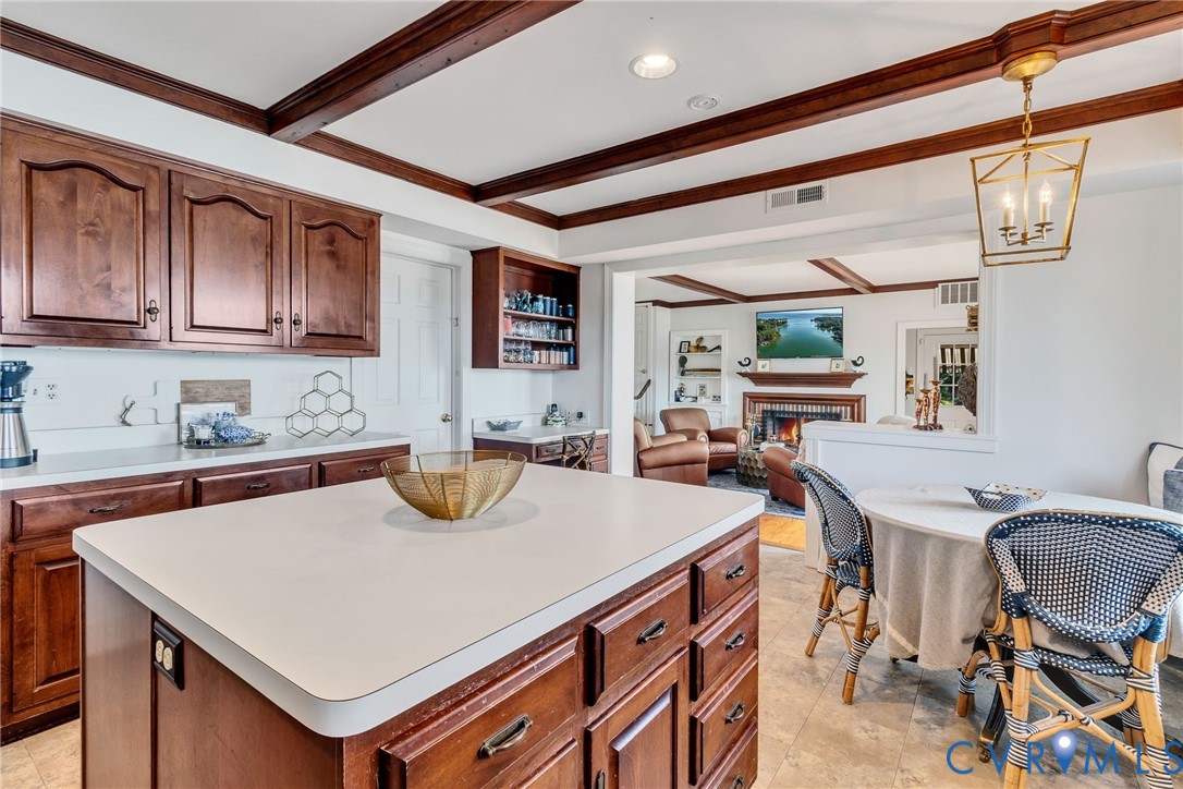 430 Harveys Neck Road Heathsville, VA 22473 - Photo 25 of 51 Kitchen featuring wood cabinetry, a center island