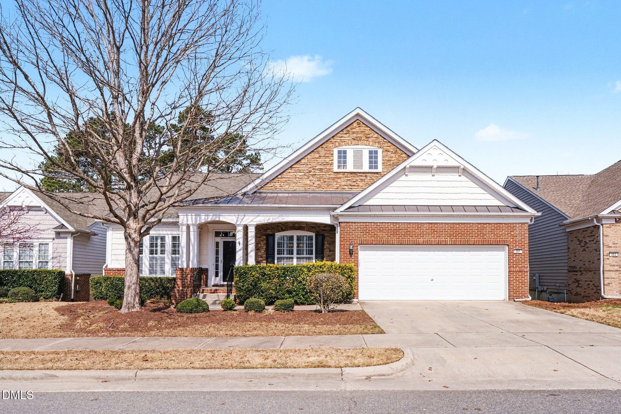 281 Beckingham Loop Cary, NC 27519 - Photo 1 of 56 a front view of a house with a yard