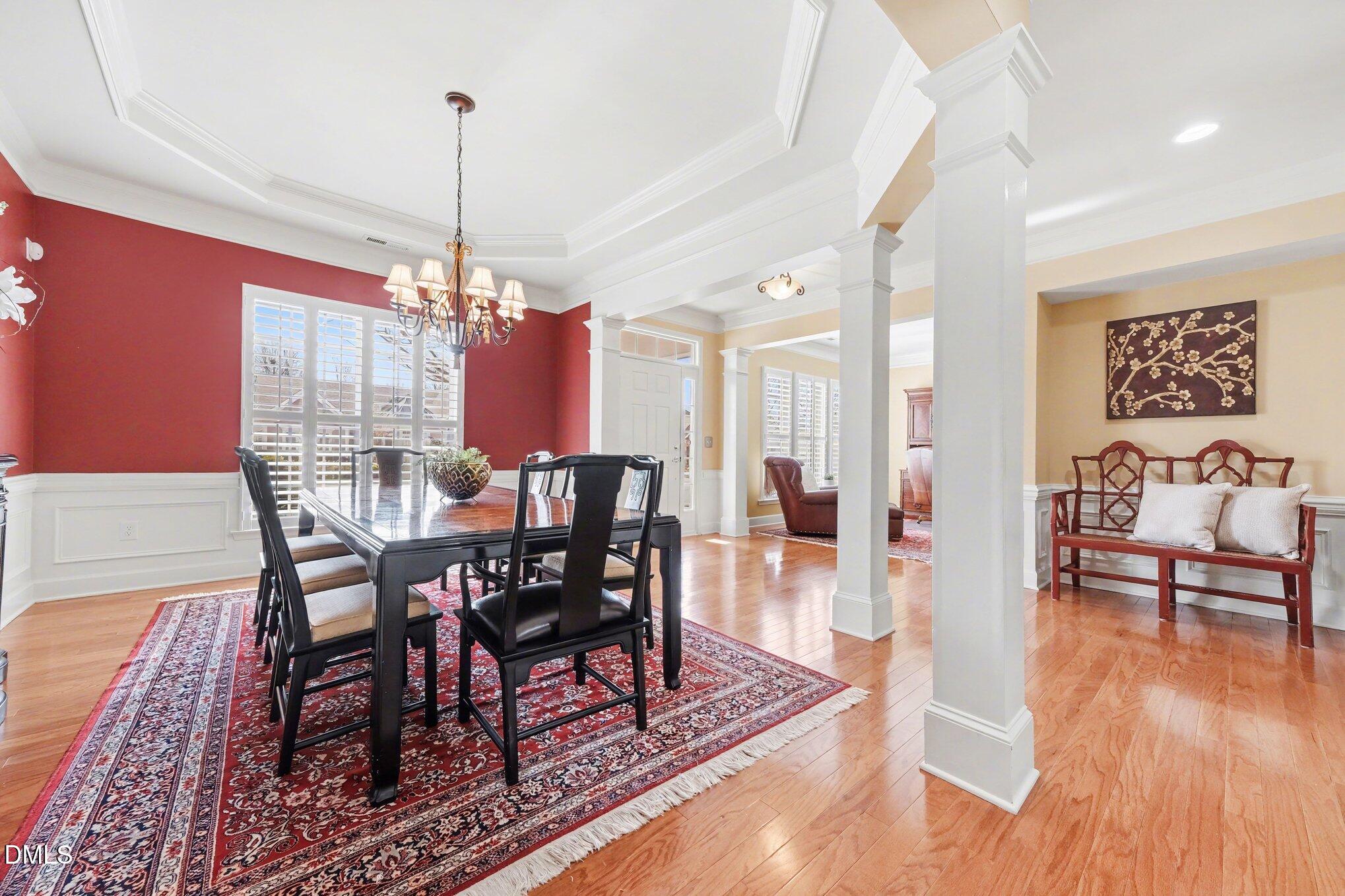 281 Beckingham Loop Cary, NC 27519 - Photo 9 of 56 a view of a dining room with furniture window and wooden floor