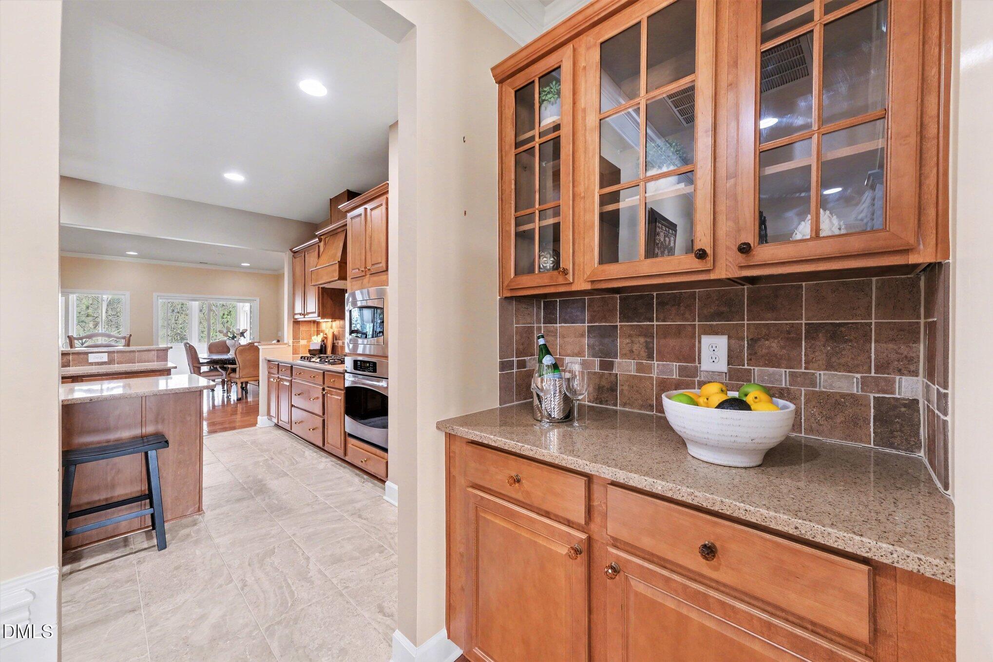 281 Beckingham Loop Cary, NC 27519 - Photo 12 of 56 a kitchen with a sink and wooden floor