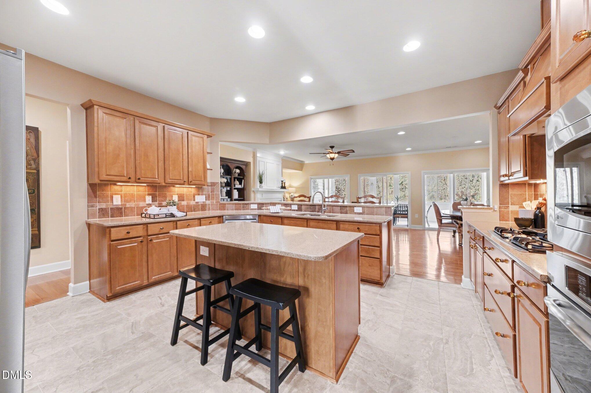 281 Beckingham Loop Cary, NC 27519 - Photo 13 of 56 a kitchen with counter top space appliances and cabinets