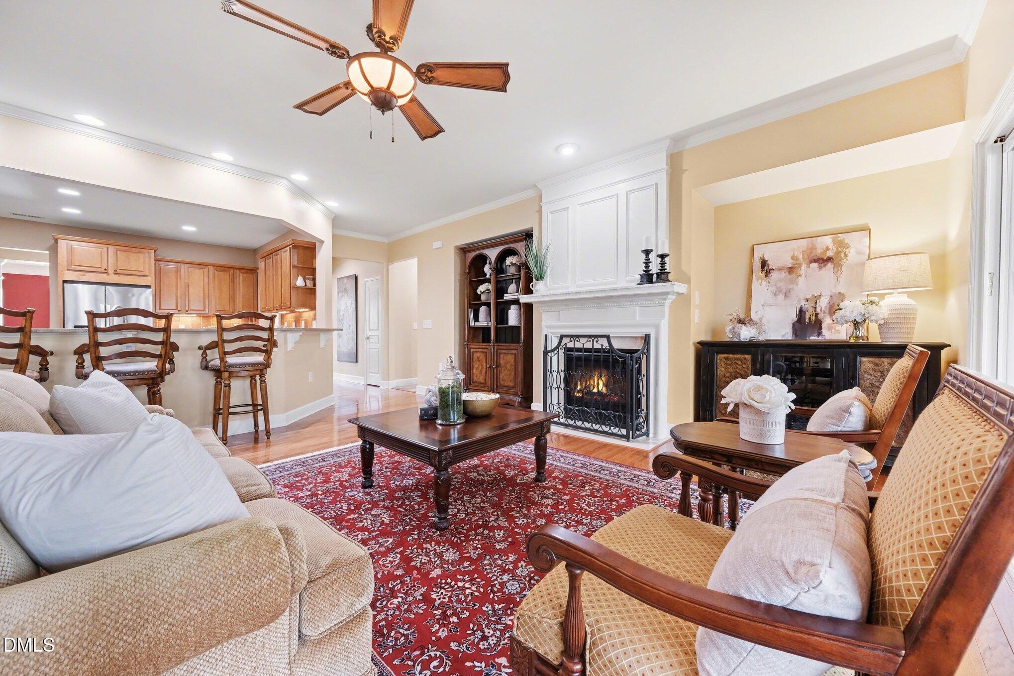 281 Beckingham Loop Cary, NC 27519 - Photo 18 of 56 a living room with furniture and a fireplace