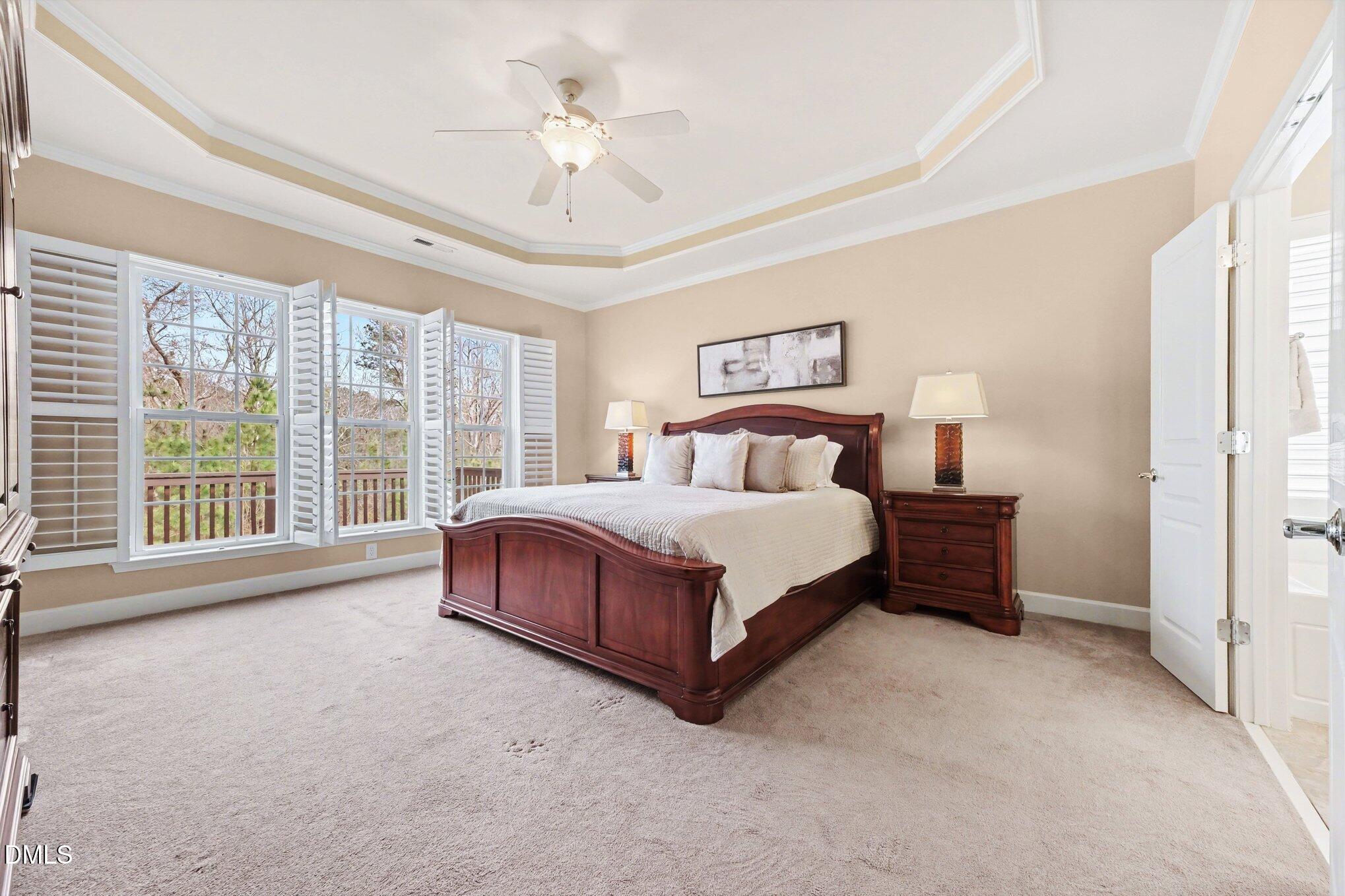 281 Beckingham Loop Cary, NC 27519 - Photo 20 of 56 a spacious bedroom with a bed and a large window