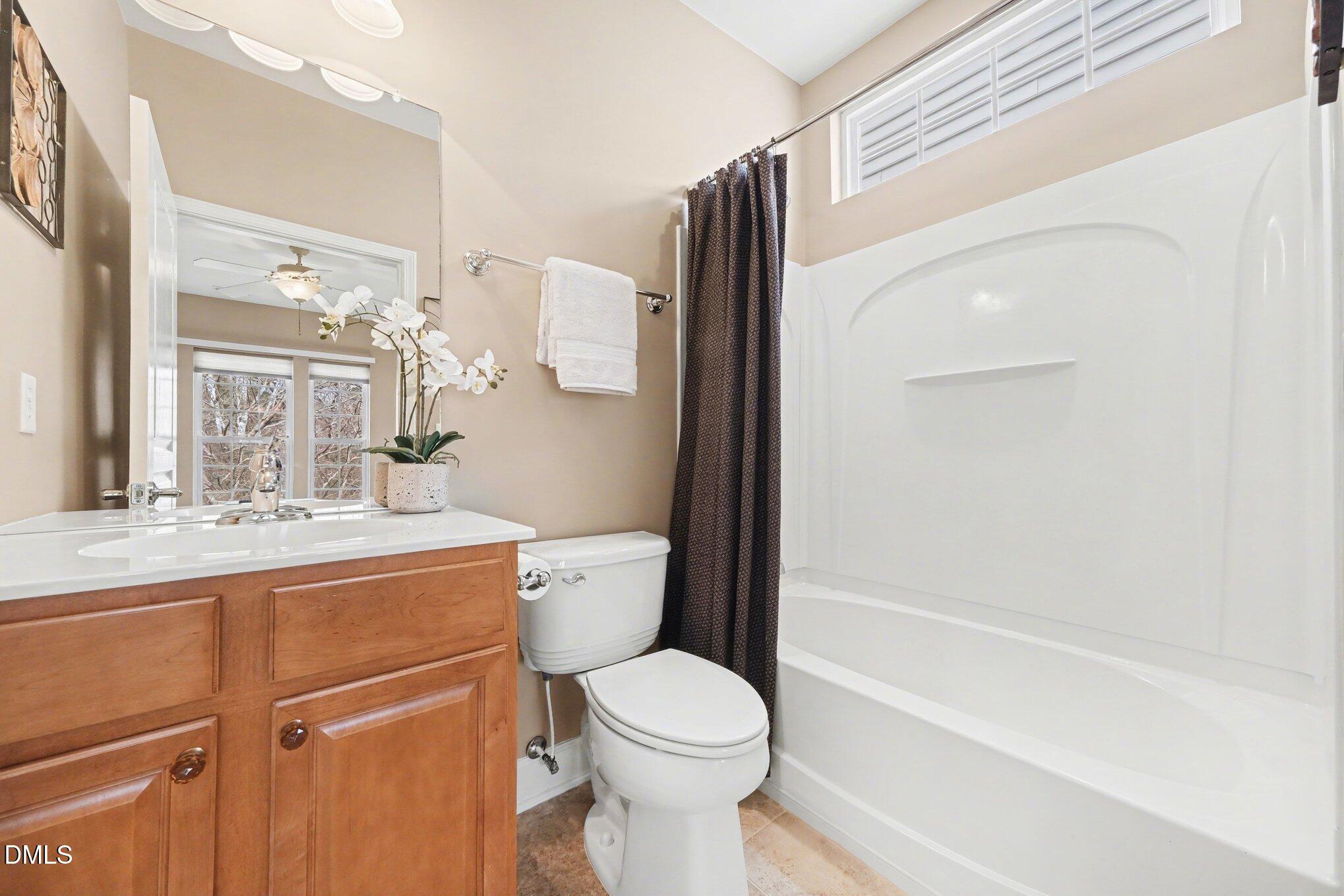 281 Beckingham Loop Cary, NC 27519 - Photo 29 of 56 a bathroom with a toilet sink and mirror