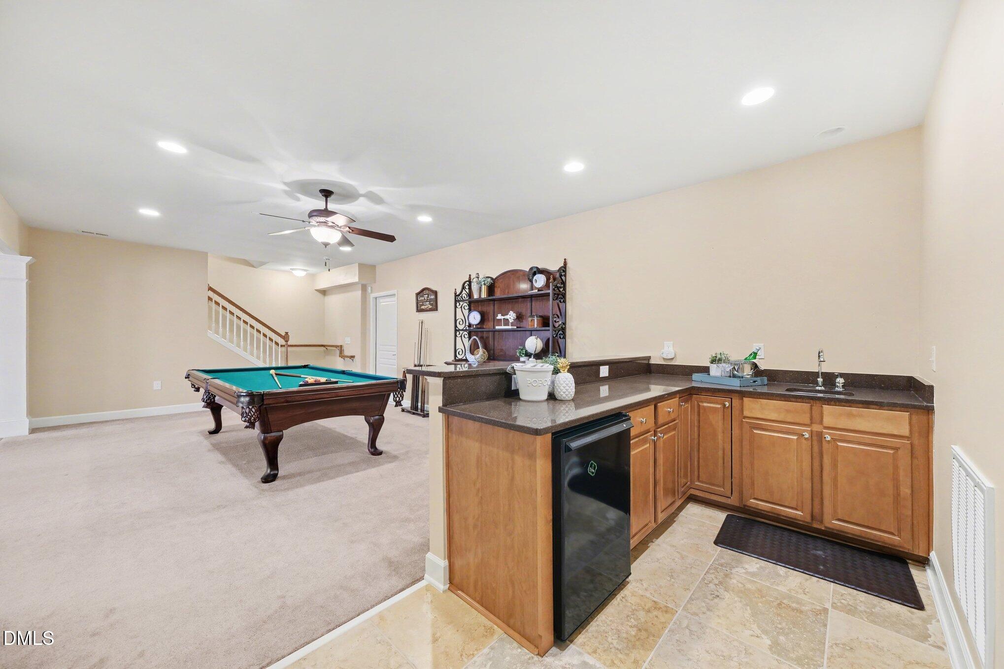281 Beckingham Loop Cary, NC 27519 - Photo 35 of 56 a living room with kitchen island furniture a sink and kitchen view
