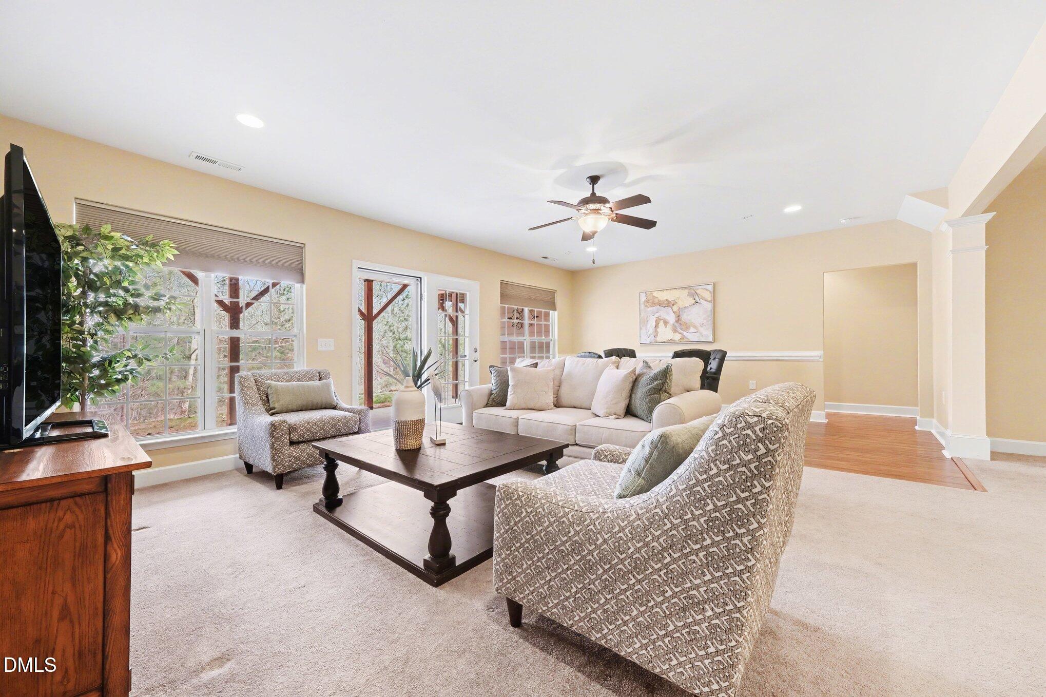 281 Beckingham Loop Cary, NC 27519 - Photo 36 of 56 a living room with furniture and a flat screen tv
