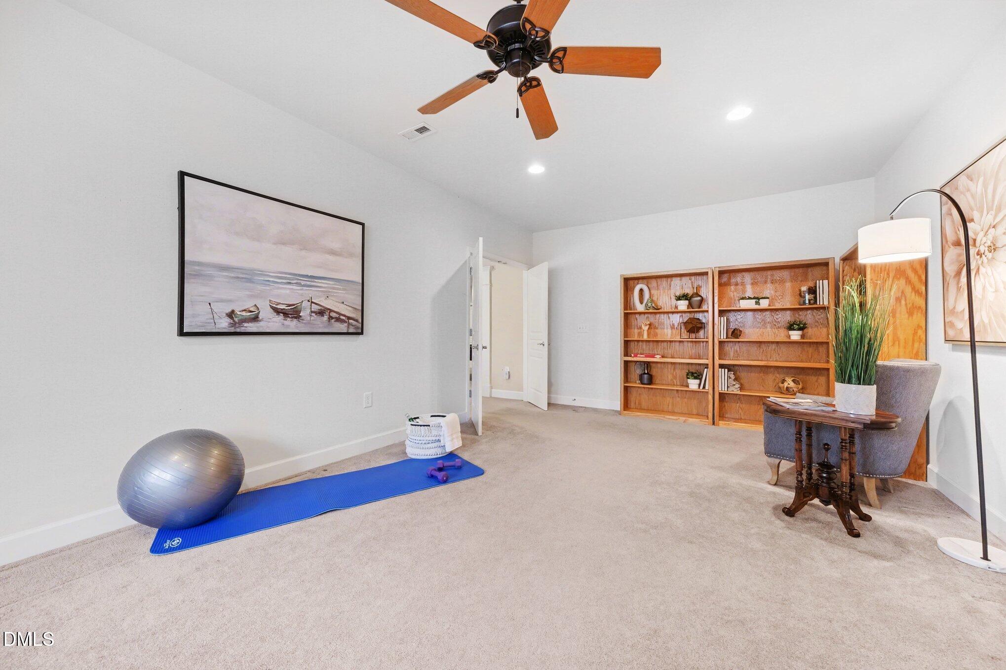 281 Beckingham Loop Cary, NC 27519 - Photo 42 of 56 a view of a workspace with furniture and a ceiling fan