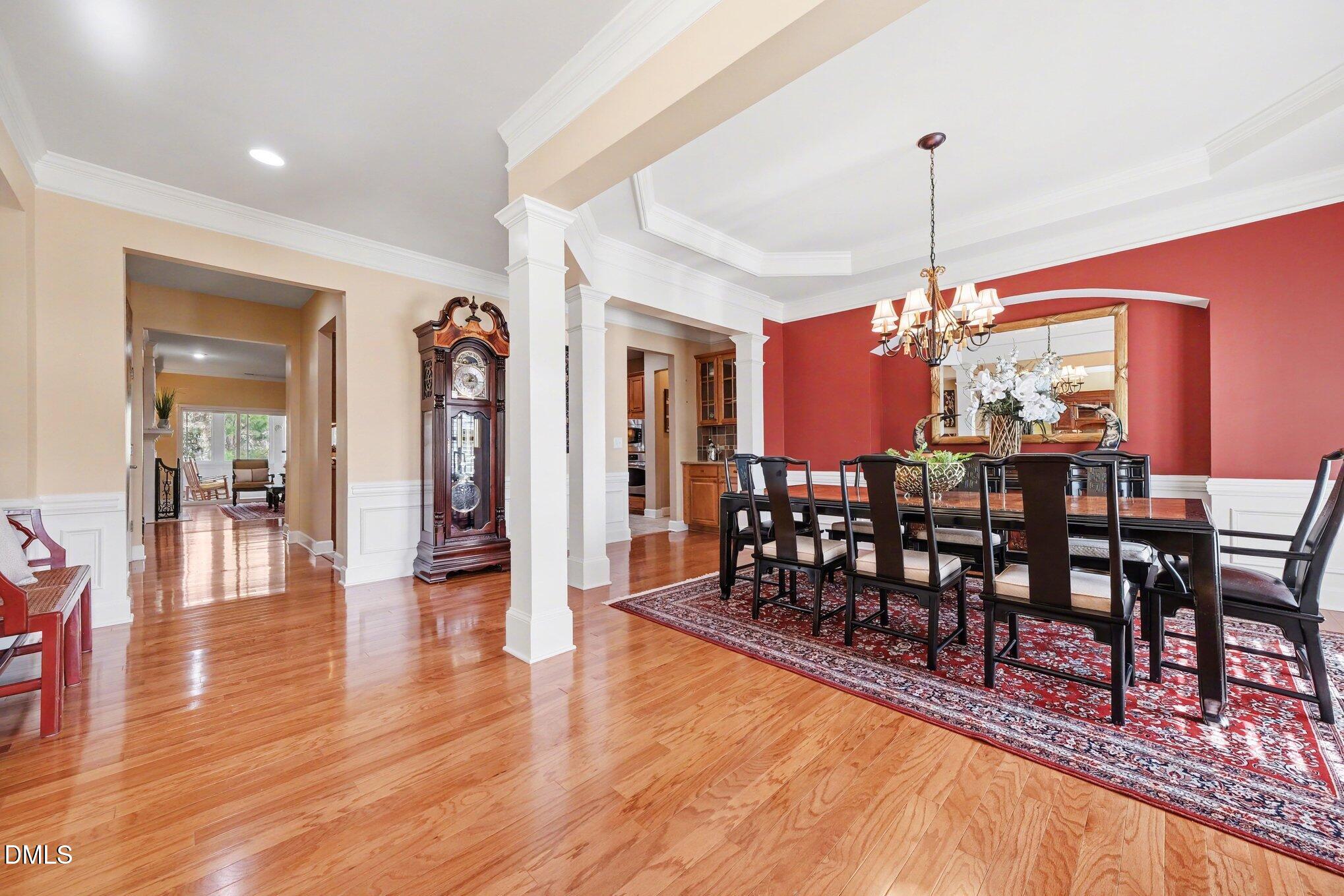 281 Beckingham Loop Cary, NC 27519 - Photo 7 of 56 a view of a dining room with furniture wooden floor and chandelier