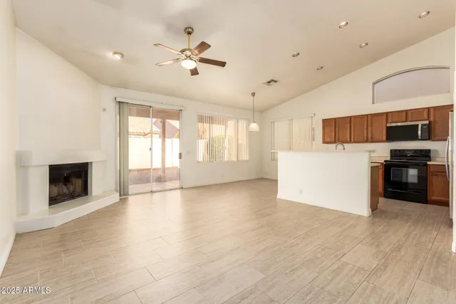 a view of a kitchen with a stove cabinets and wooden floor