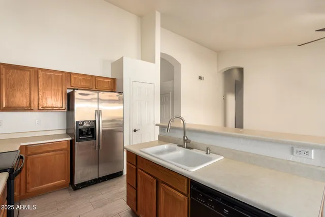 a kitchen with a sink and refrigerator