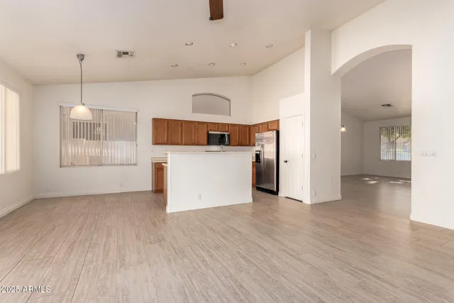 a view of a kitchen with a microwave and a stove