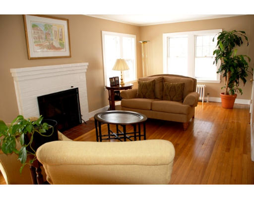 63 Moffat Road Newton, MA 02468 - Photo 2 of 7 a living room with furniture and a fireplace