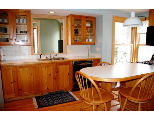 63 Moffat Road Newton, MA 02468 - Photo 5 of 7 a dining room with a sink a counter top space and a window