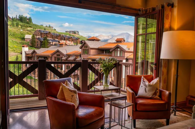 a view of a balcony with chairs