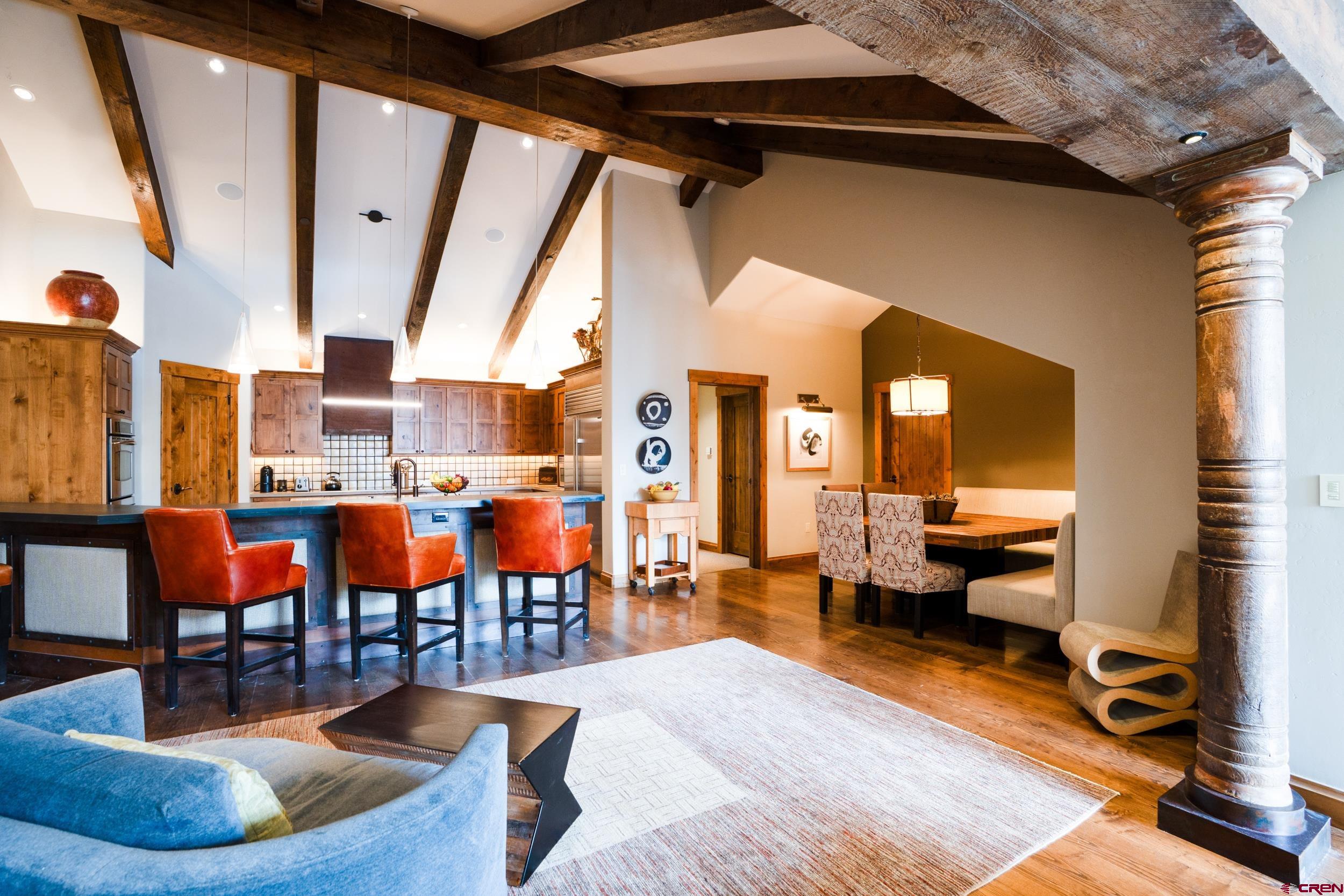 14 Hunter Hill Road, Unit A405 Crested Butte, CO 81225 - Photo 12 of 38 a living room with patio furniture and a large window