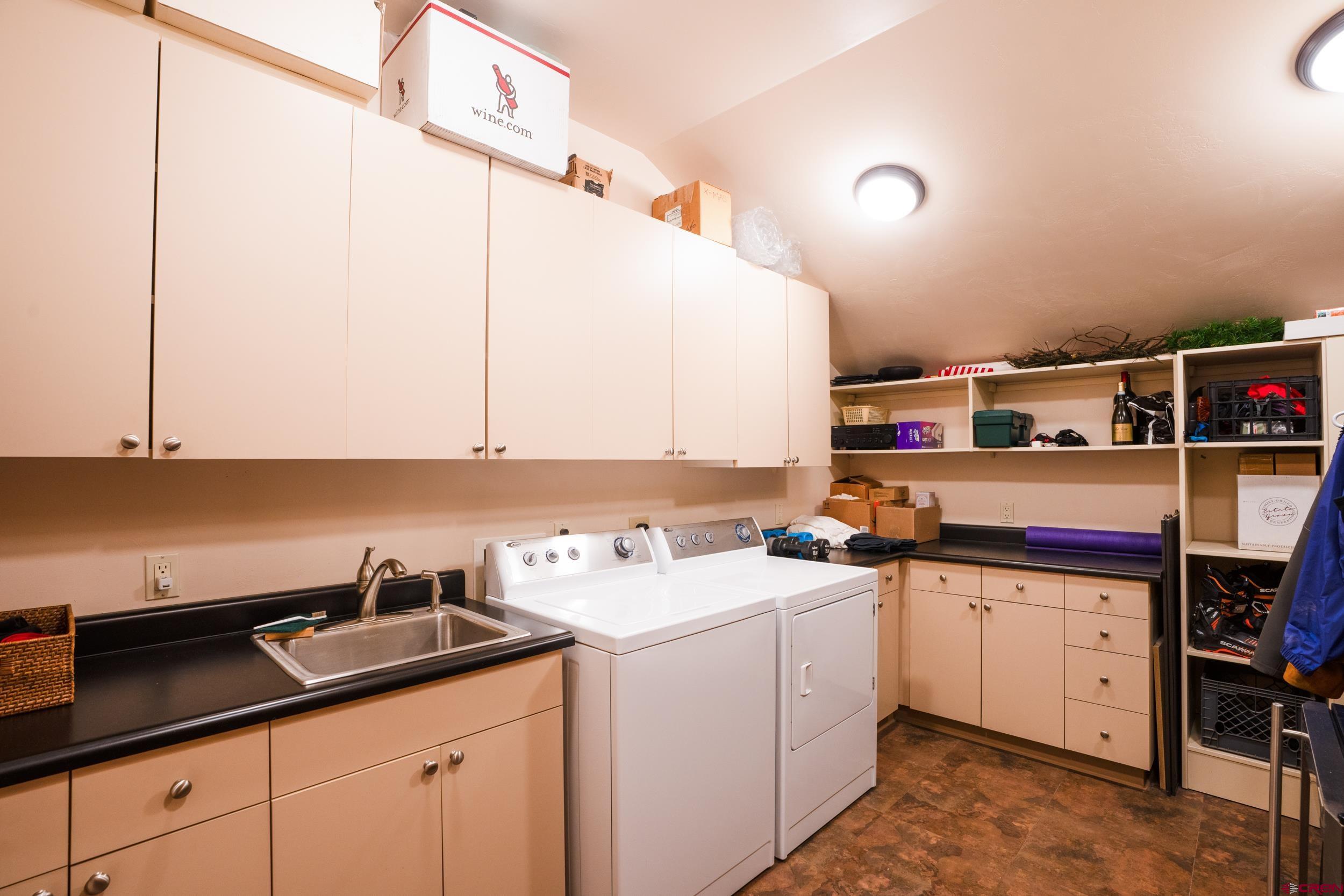 14 Hunter Hill Road, Unit A405 Crested Butte, CO 81225 - Photo 25 of 38 a kitchen with a sink and cabinets