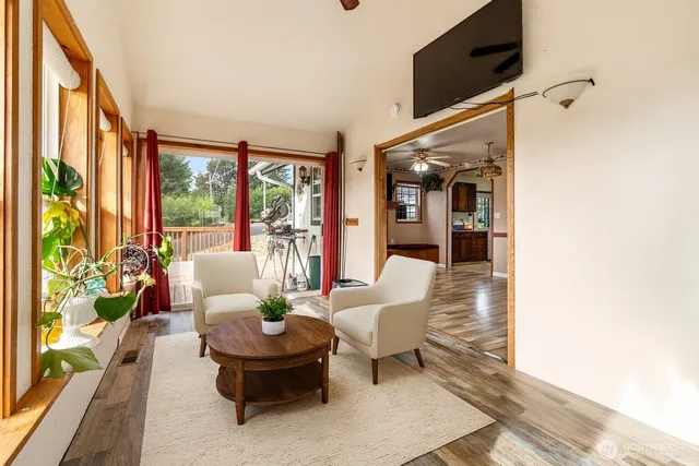 a living room with furniture and a large window