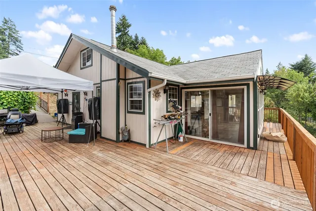 a view of a house with sitting area and wooden floor