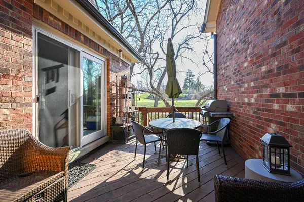 a view of a patio with iron fence