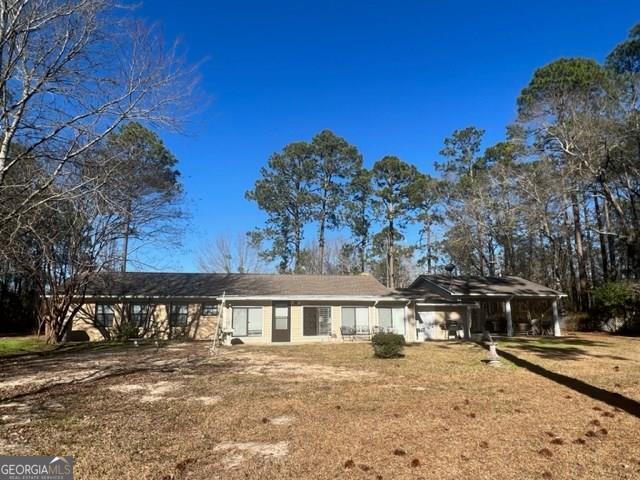 192 Old Graham Road Hazlehurst, GA 31539 - Photo 1 of 1 a front view of a house with a yard