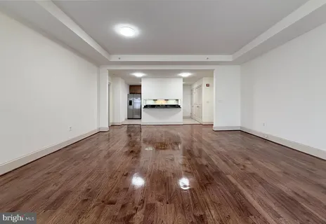 a view of a room with wooden floor