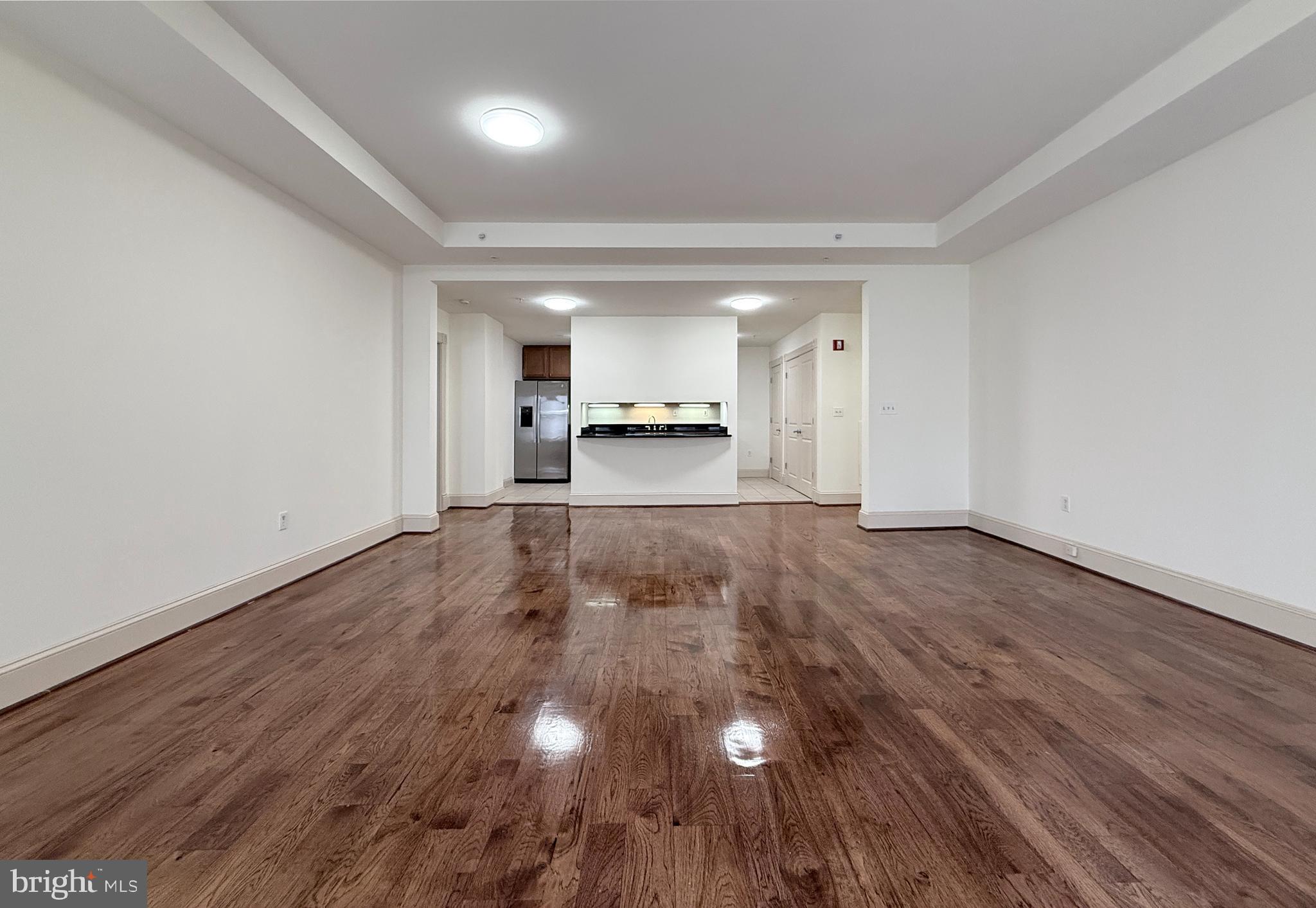515 9th Street Northwest, Unit 3E Washington, DC 20004 - Photo 12 of 20 a view of a room with wooden floor
