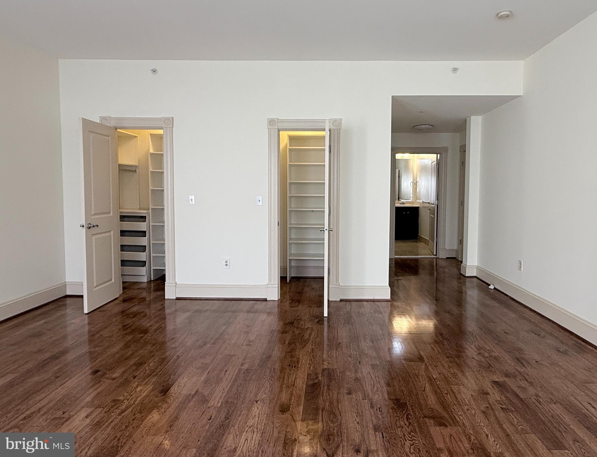 515 9th Street Northwest, Unit 3E Washington, DC 20004 - Photo 17 of 20 an empty room with wooden floor and closet