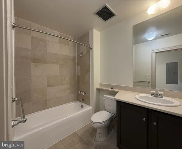 a bathroom with a sink a toilet and a bathtub