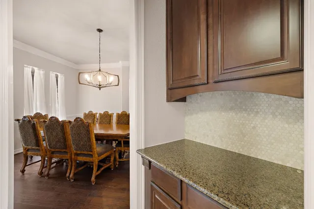 a view of a kitchen counter space and chandelier