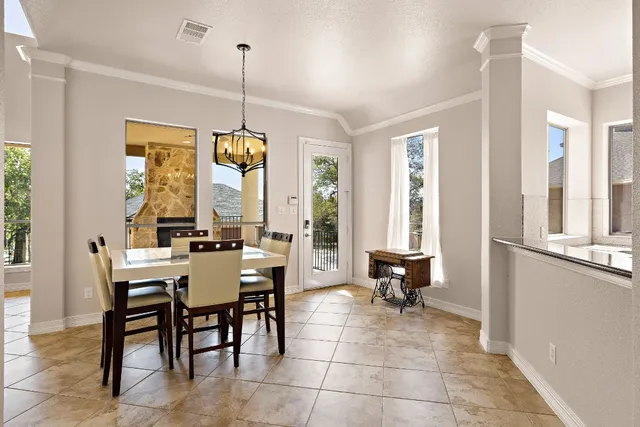 a view of a dining room with furniture window and outside view