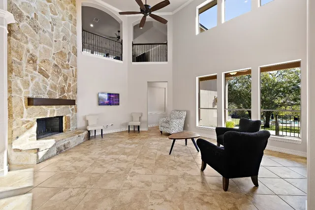 a living room with furniture and fireplace