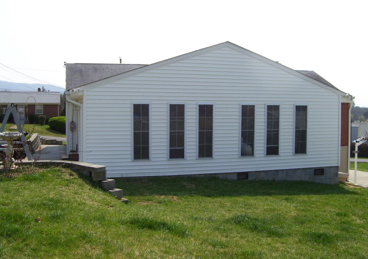 261 Post Road Roanoke, VA 24019 - Photo 6 of 6 a wooden house with a yard plants and big trees