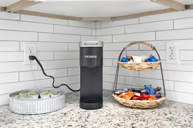 a table and a vase of flowers sitting on a table
