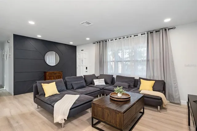 a living room with furniture and a window