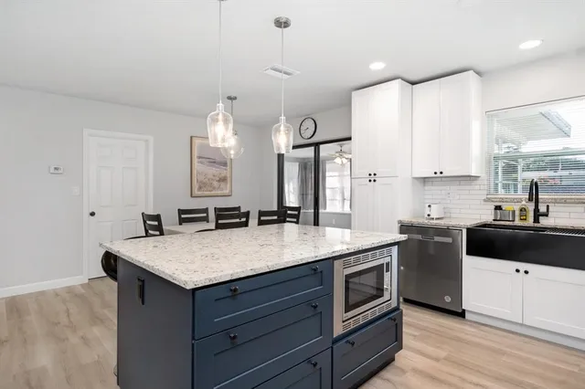 a kitchen with a stove and a sink