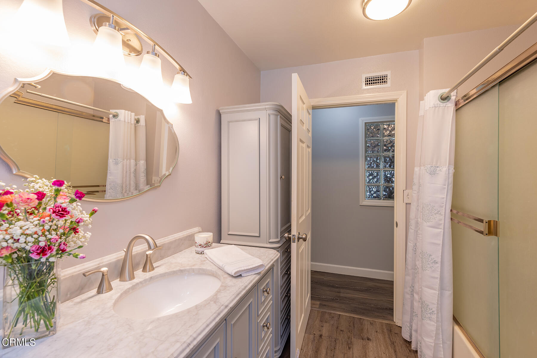 1131 Rancho Drive Ojai, CA 93023 - Photo 12 of 16 a bathroom with a granite countertop sink vanity granite and a mirror