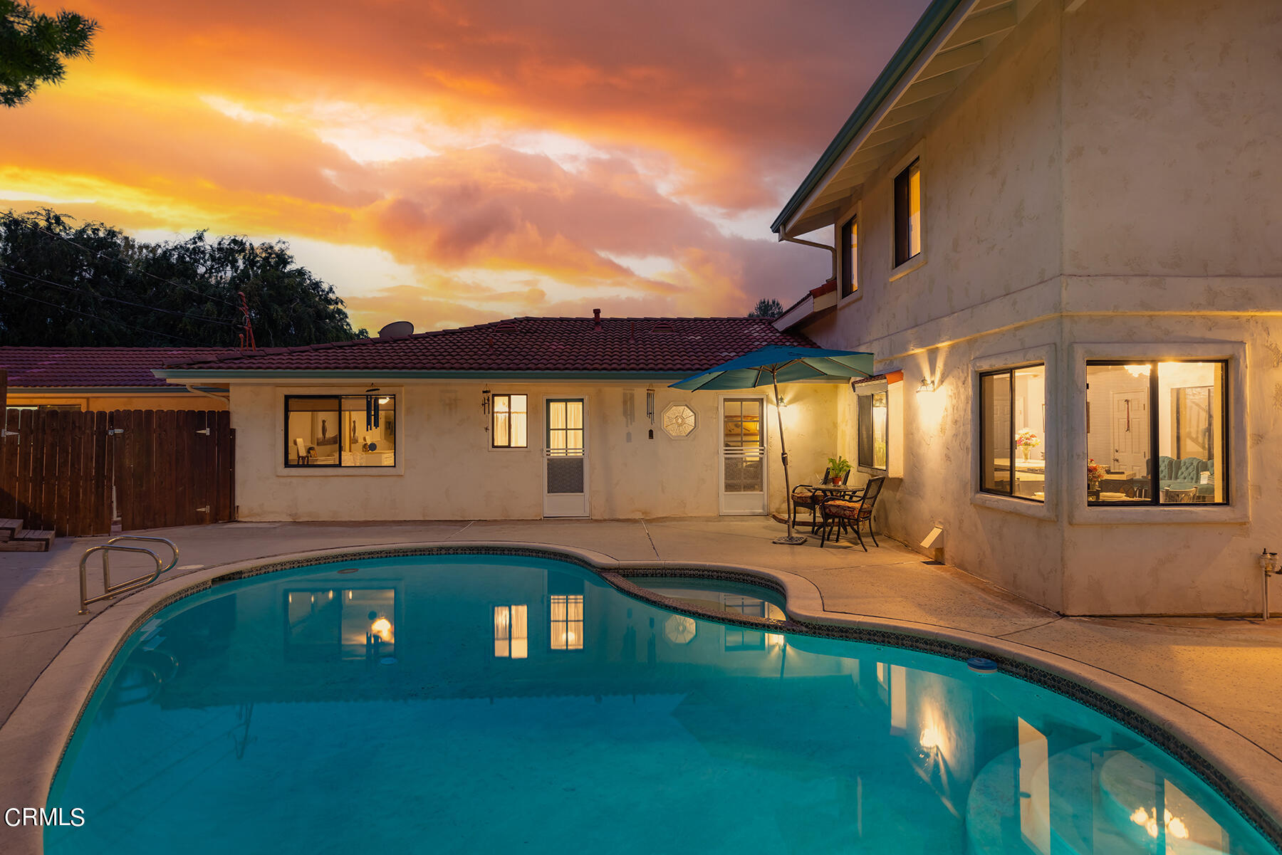1131 Rancho Drive Ojai, CA 93023 - Photo 3 of 16 a front view of a house with swimming pool having outdoor seating