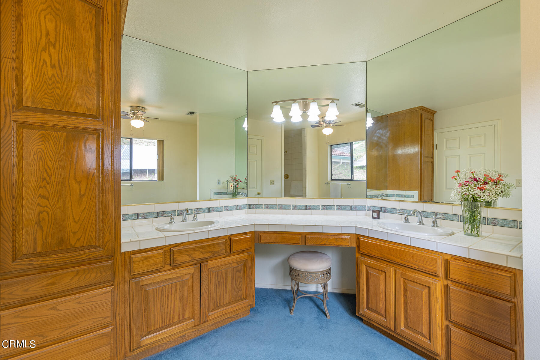 1131 Rancho Drive Ojai, CA 93023 - Photo 9 of 16 a spacious bathroom with a granite countertop sink mirror and a