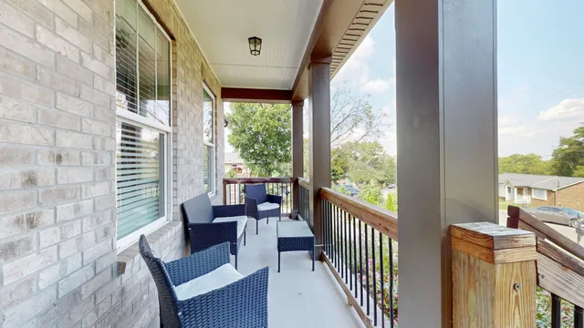 a view of a porch with furniture