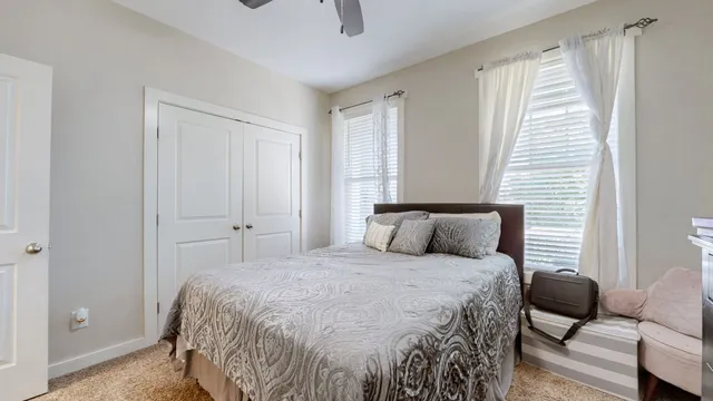 a bedroom with a bed and a couch