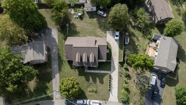 an aerial view of a house with outdoor space