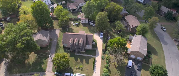 an aerial view of a house with outdoor space
