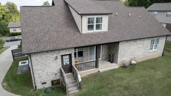 front view of a house with a yard