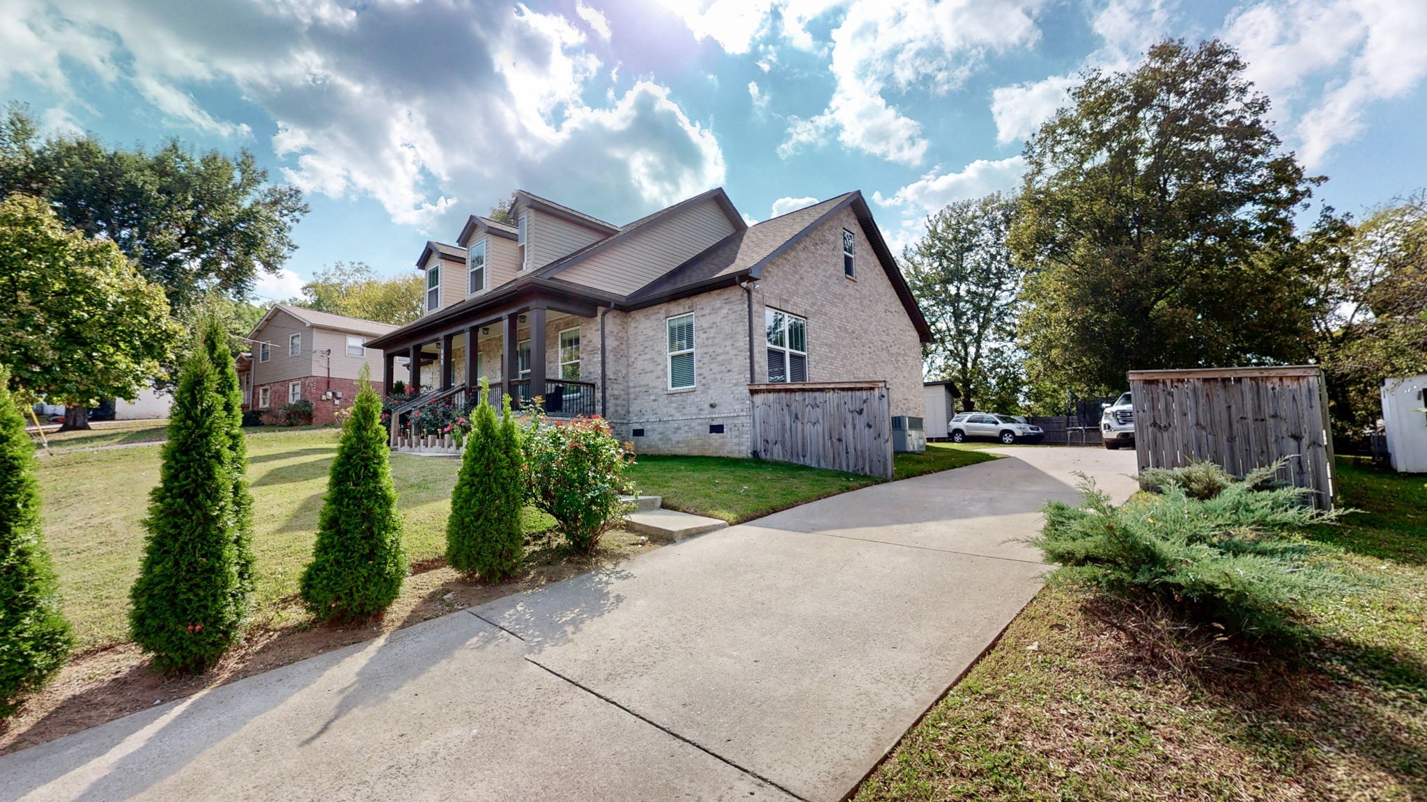 234 Cedarview Drive Antioch, TN 37013 - Photo 8 of 50 a view of a house with a small yard plants and large tree